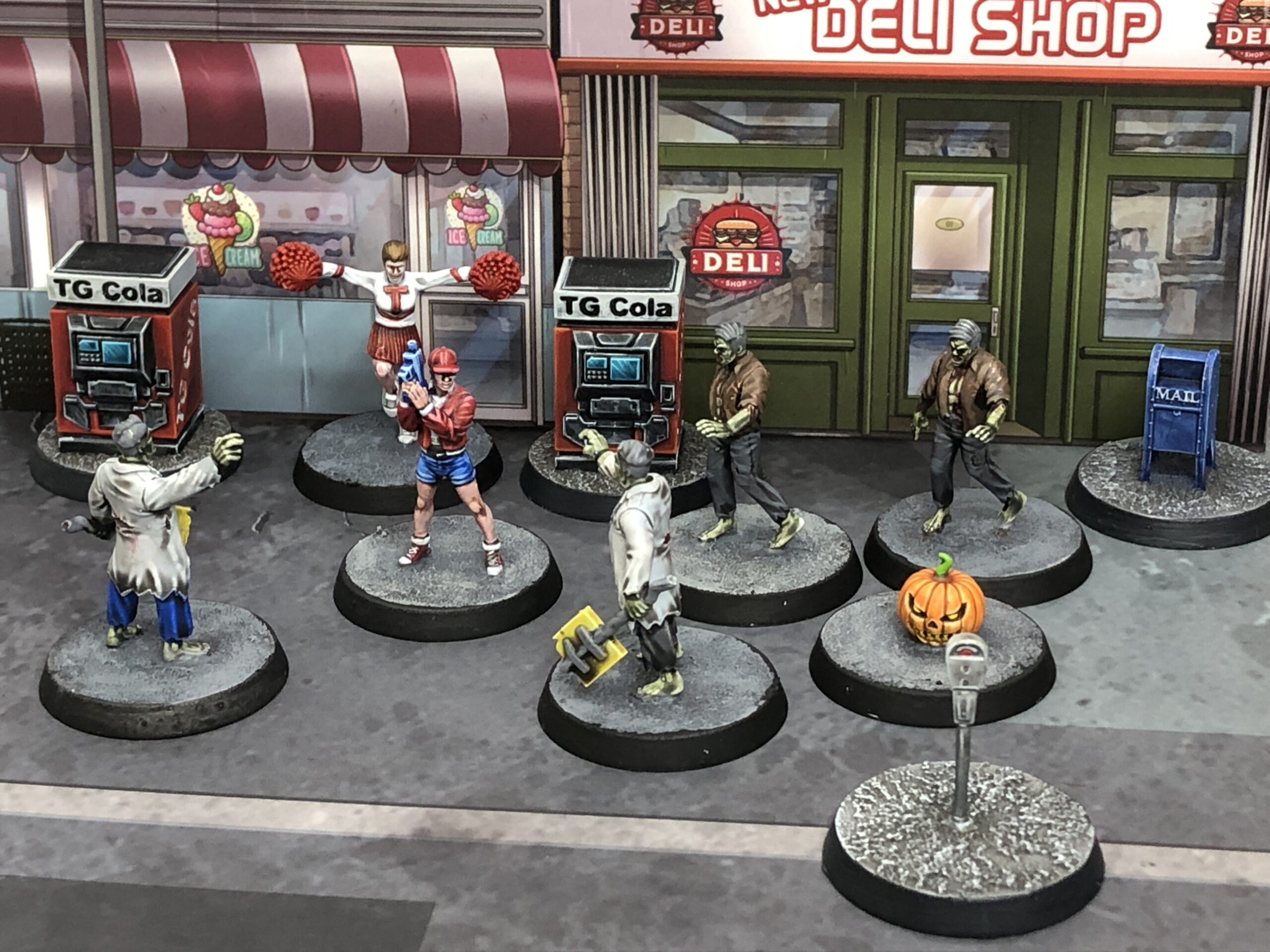 Monsters Invaded My Town miniatures: heroes and civilians among zombies in the street