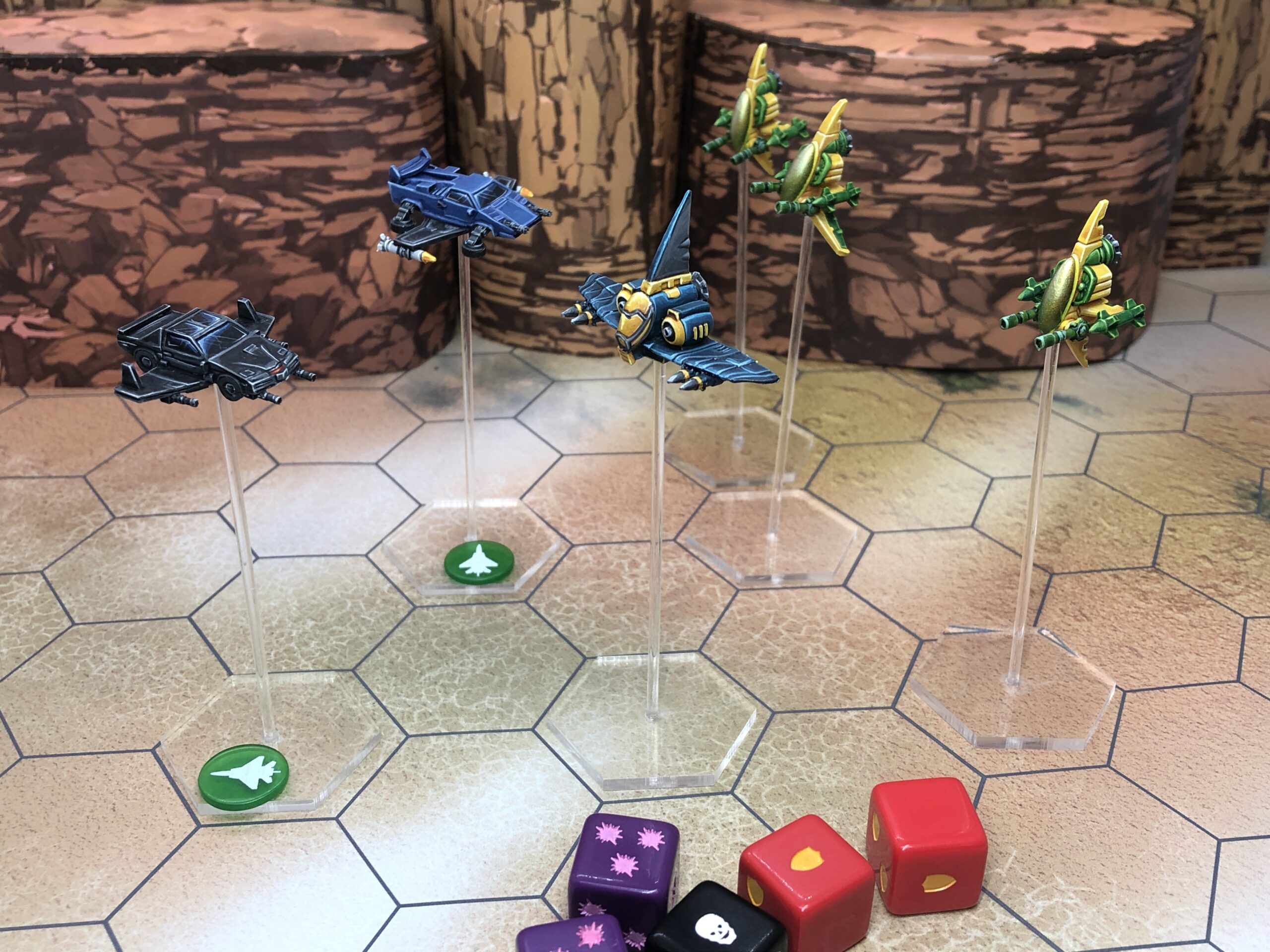 Broken Skies aircraft on flight stands over the hex board, with dice