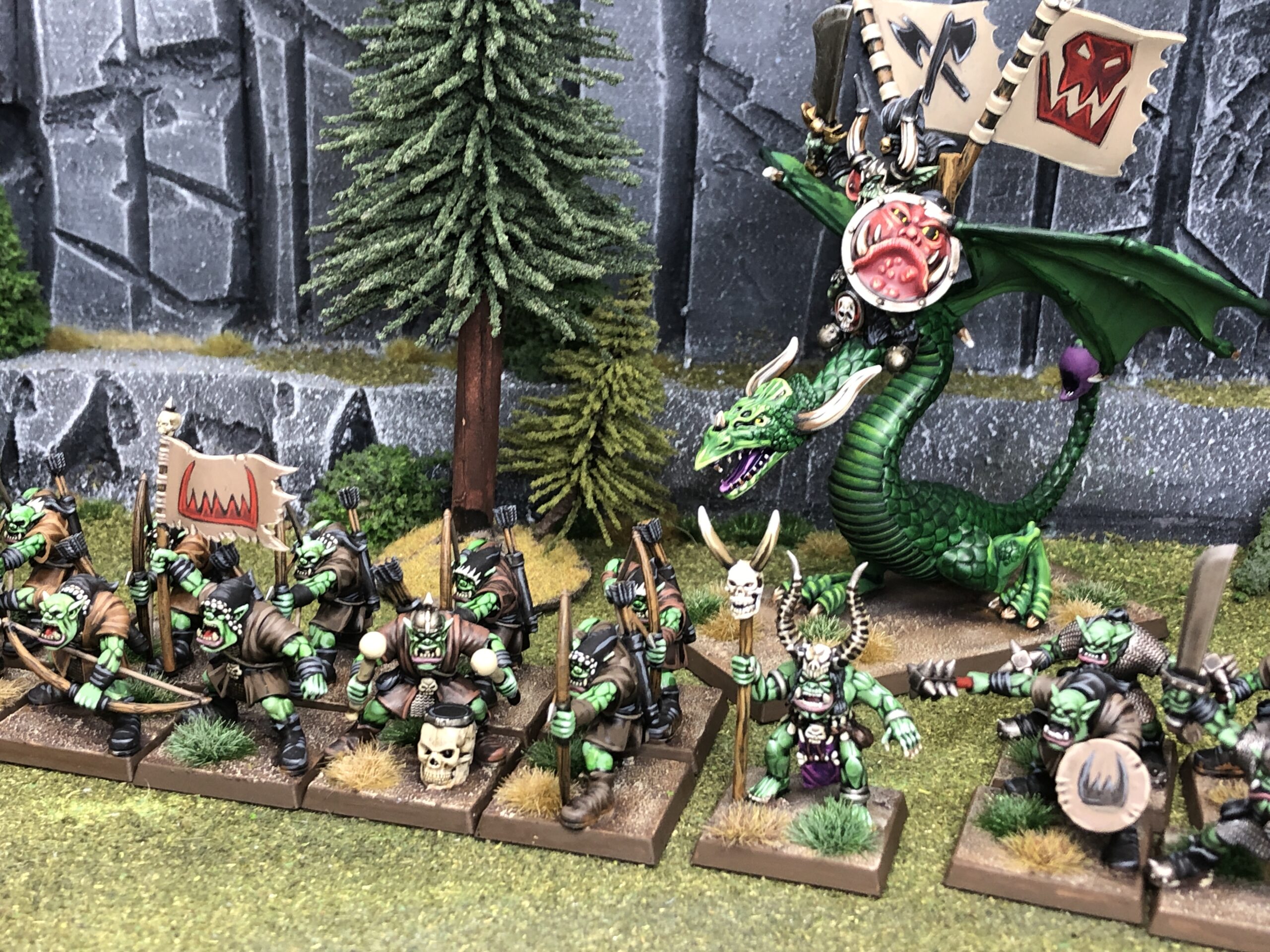 Undead horde and a bone-winged beast rider beneath a castle and a green moon